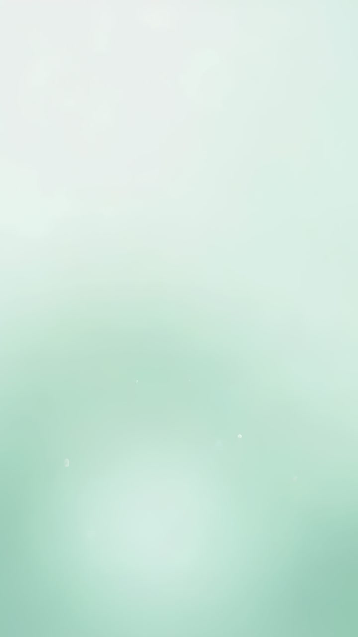 Vertical video: Shifting pale aqua gradient on wash across five frames, showing soft bokeh motion