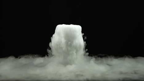 cognac glass with the effect of white dry ice at black background - cognac glass with the effect of white dry ice on black background at studio, chemical reaction with smoke on dark surface