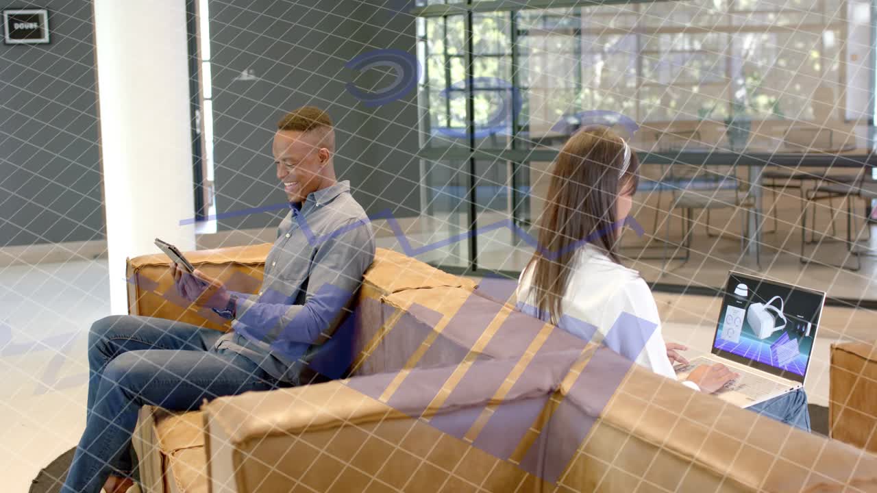 Man holding tablet, glancing and smiling, initiating business engagement while woman typing laptop