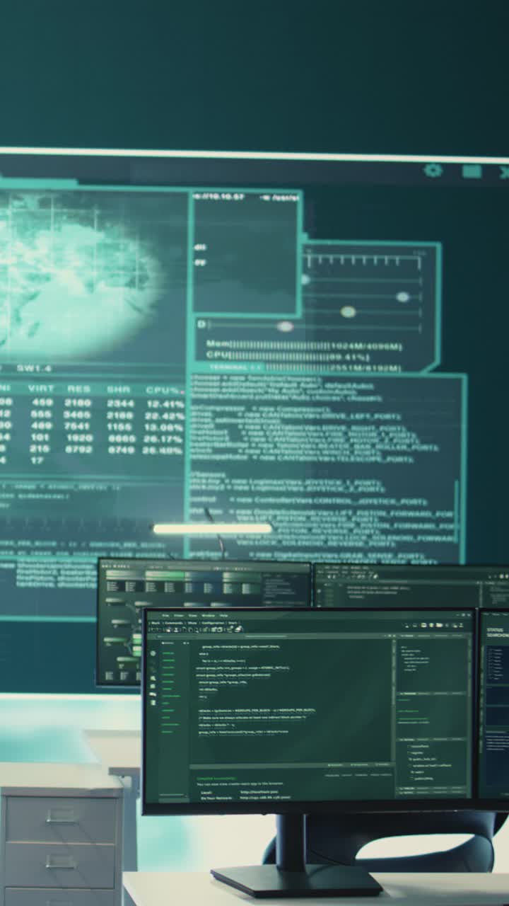 Multiple Computer Screens Displaying Programming Code and Data