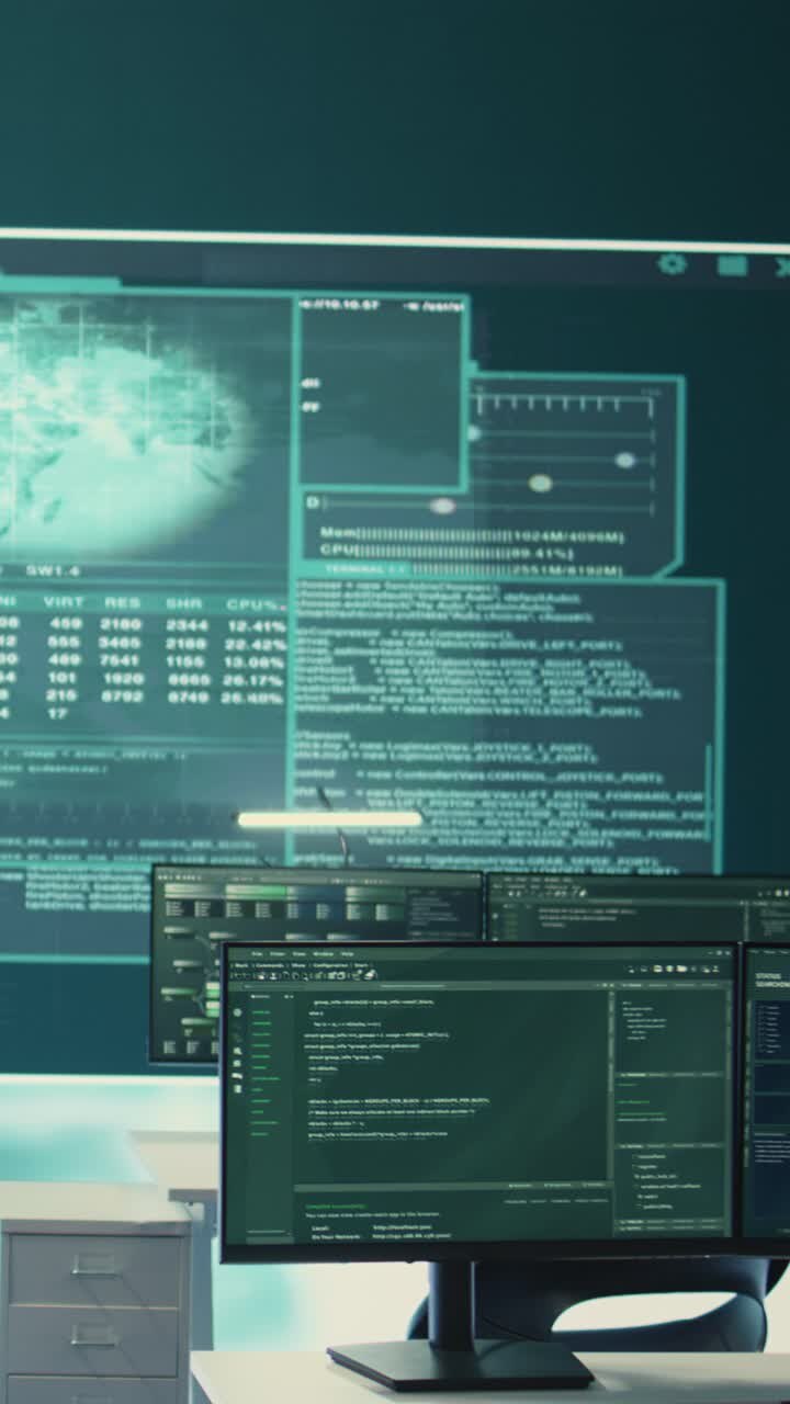 Multiple Computer Screens Displaying Programming Code and Data