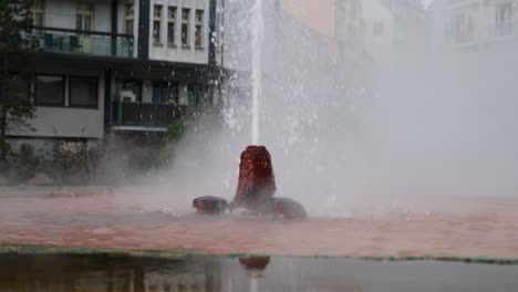 Karlovy-Vary,-Czech-Republic,-Slow-Motion-of-Hot-Spring-Fountail,-Mineral-Water-Spraying-Like-Geyser