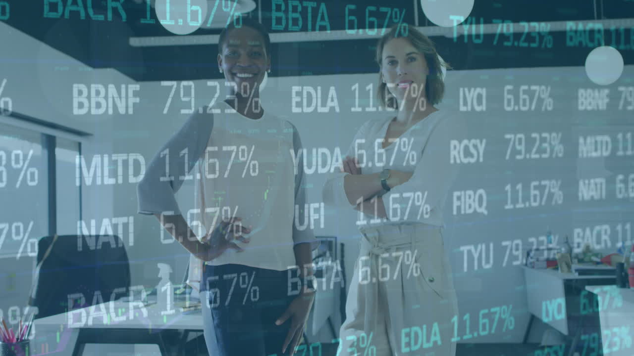 Animation of stock market data processing against portrait of two diverse women smiling at office