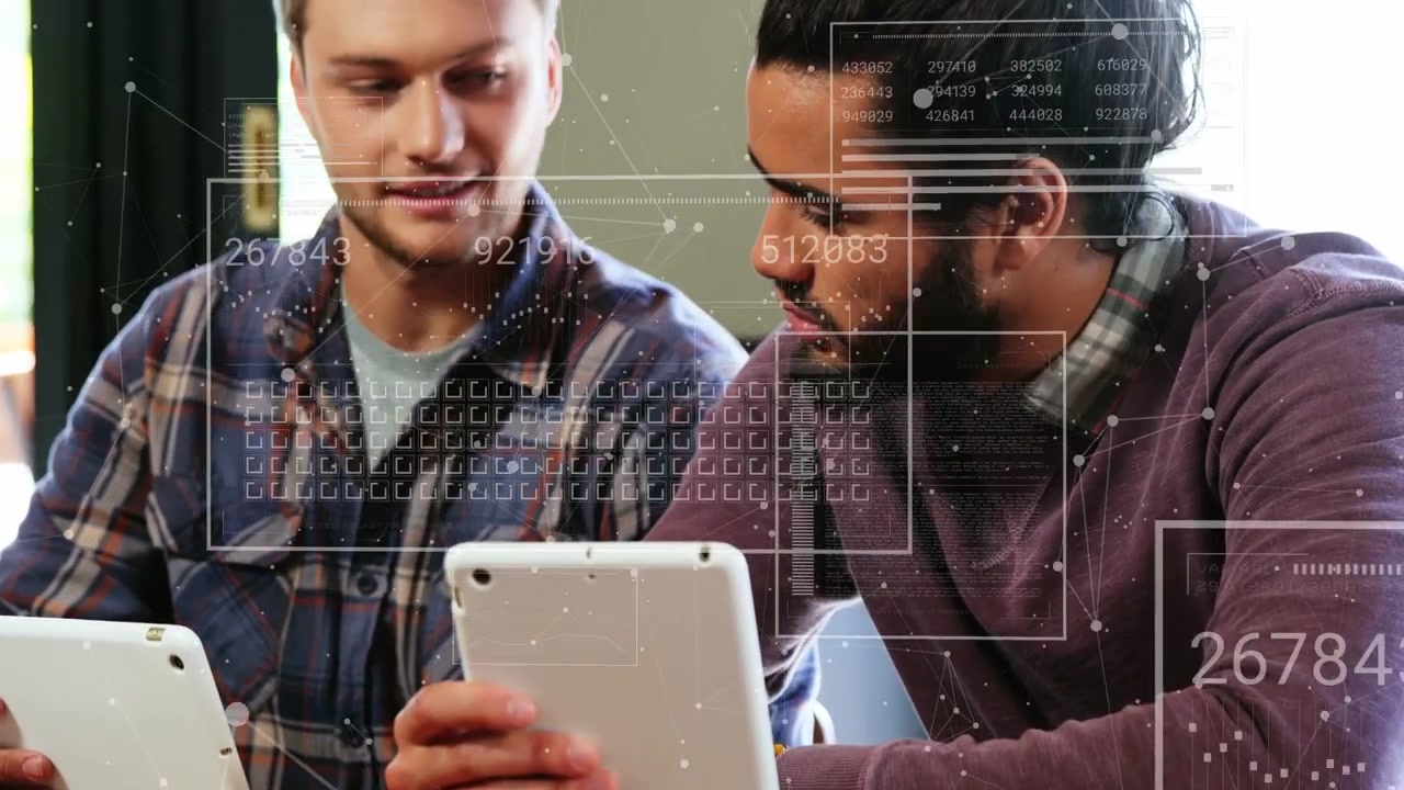 Right man bringing tablet closer at wooden table, colleagues working on data with HUD overlay