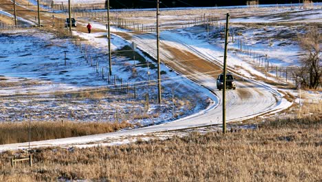 Car-driving-on-a-dirt-road-in-the-countryside