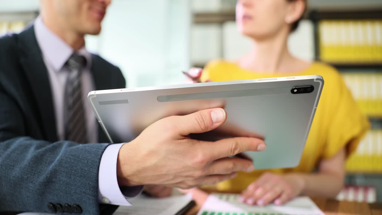 Business meeting with tablet presentation