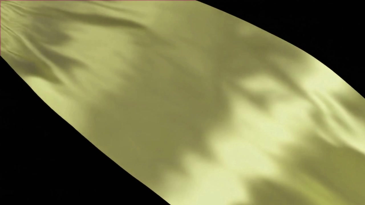 Flowing Yellow Silk Fabric Against Black Background