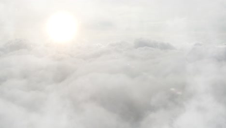 white cloud surface with shining sun