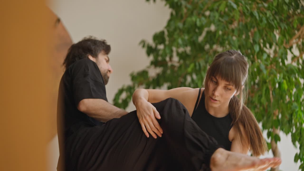 Couple Doing Yoga Exercises