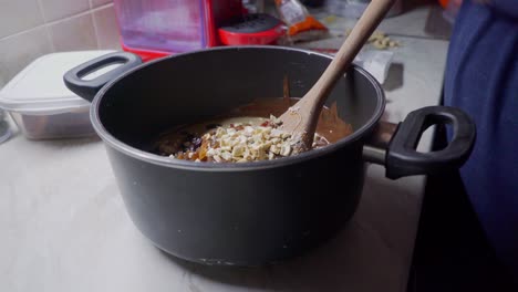 Close-up-footage-of-preparation-of-healthy-energy-bars,-made-with-couverture-chocolate-and-cereal