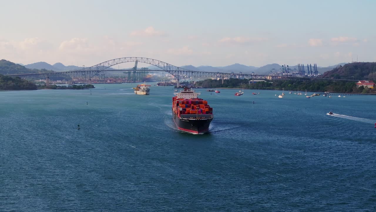 Ship leaving the Panama canal with the Americas bridge in the background