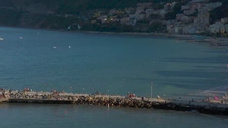 drone flying above the coast of laigueglia, liguria