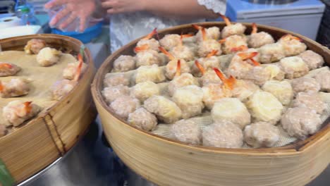 steamed shrimp dumplings at a street food stall