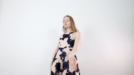captivating caucasian dancer engaging in thoughtful movement in a white room