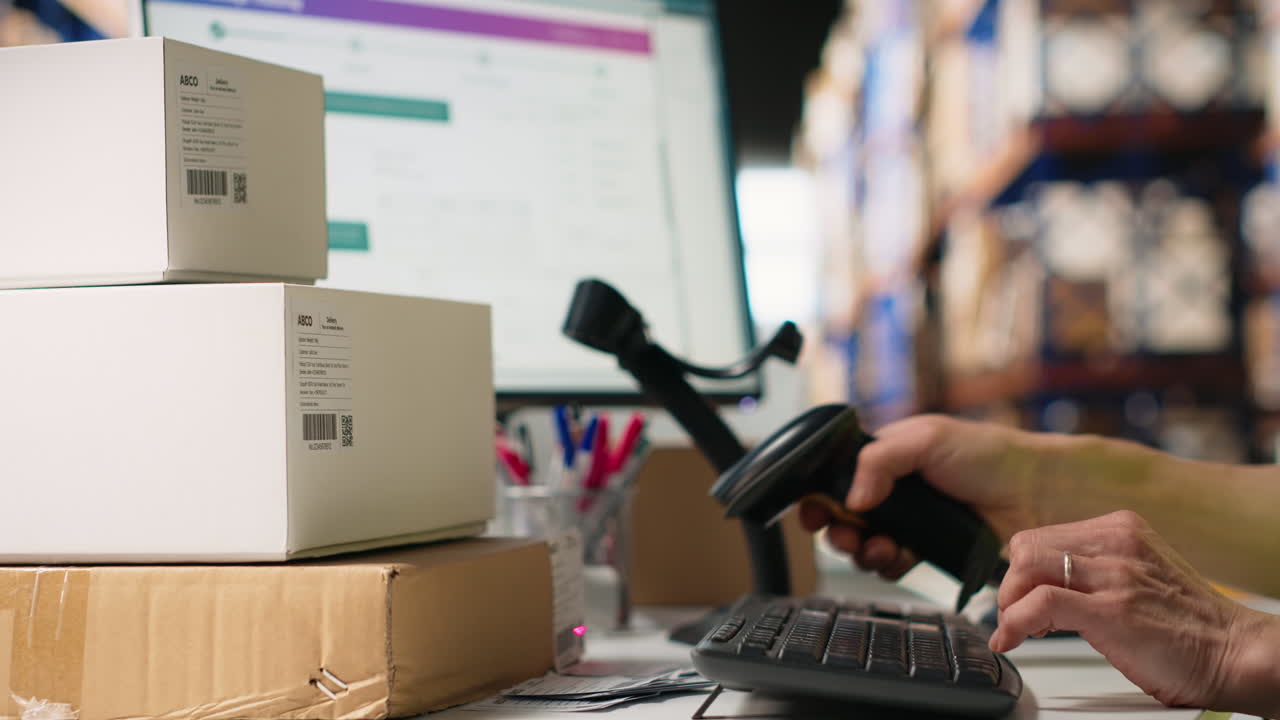 Vertical Video Logistics hub worker uses scanner on tracking info tags for express delivery