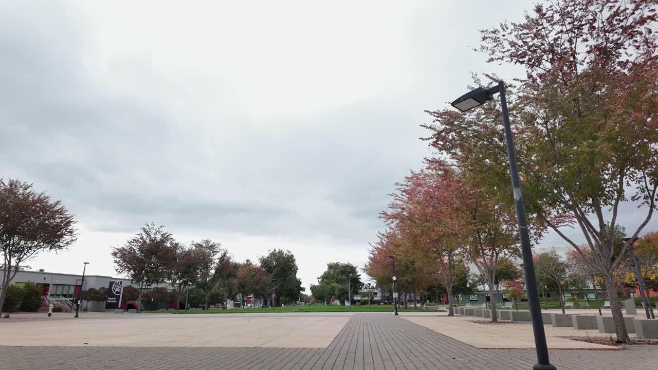 Moving up to down time lapse of the courtyard at a community college in San Jose California