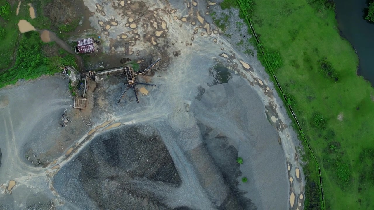 San Miguel, Catanduanes, Philippines - A River Quarry With Machinery and Equipment for Extraction - Orbit Drone Shot