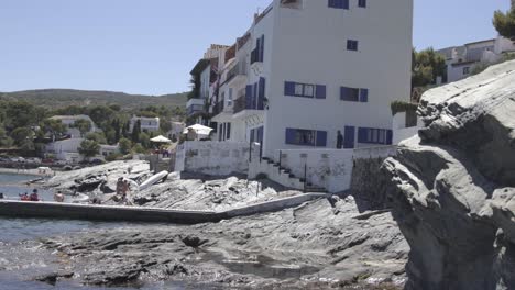 white house in coast town, clear sky, costa brava, spain, static shot