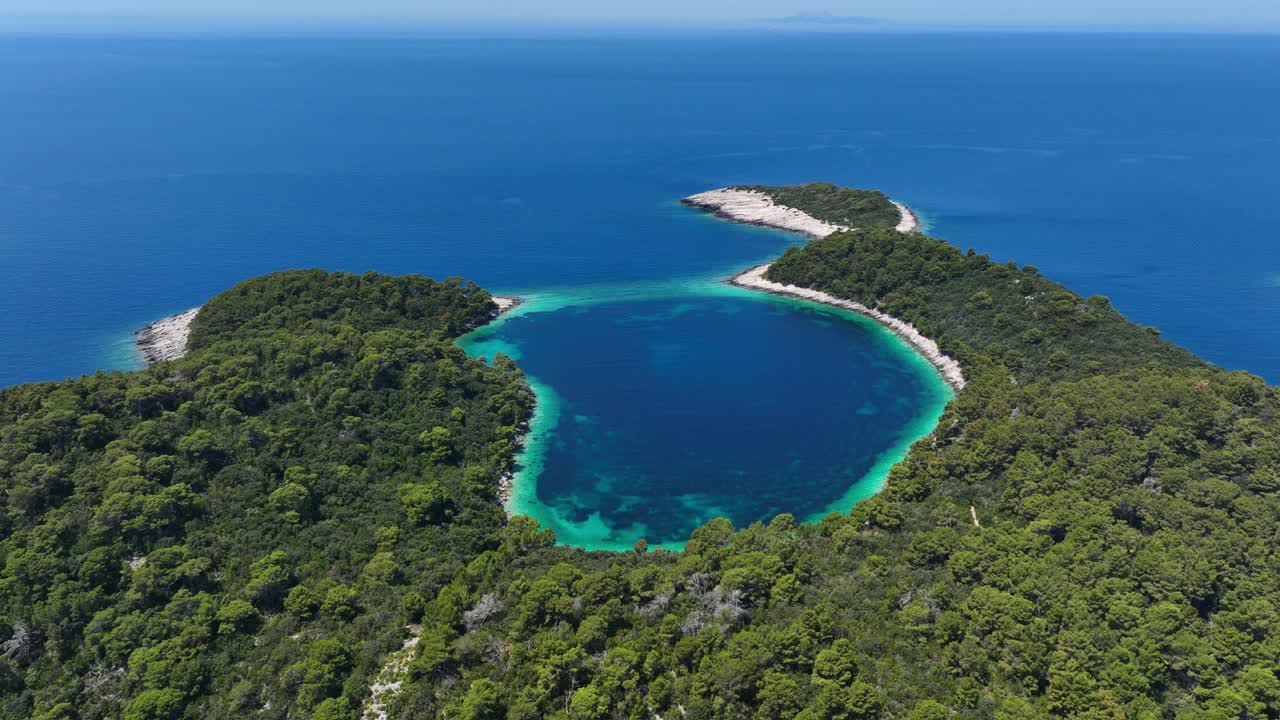 Blue Lagoon on Mljet Island Coast in Adriatic Sea Aerial Establishing