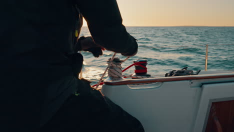 Boat,-Sailor-hand-and-rope-of-yacht-for-sailing