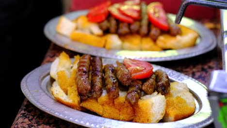 Sliced-tomatoes-are-placed-on-top-of-the-meatballs