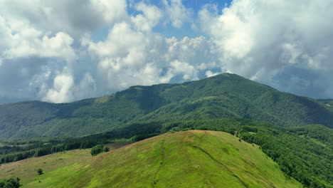 flight over green mountain peaks