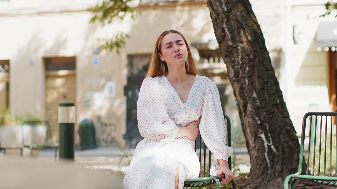 Caucasian young woman traveler feeling sudden strong abdominal stomach ache gastritis problem