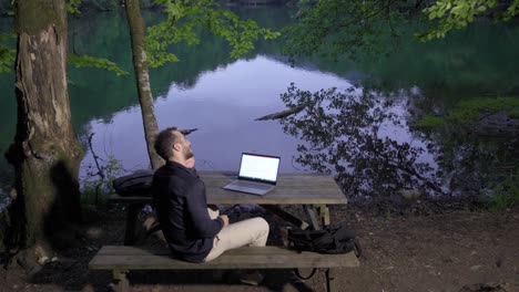 businessman talking by phone in nature.