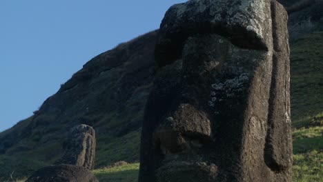 giant half carved faces stand at the quarry on easter island