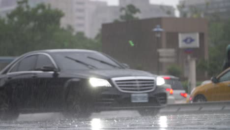 car driving through heavy rain