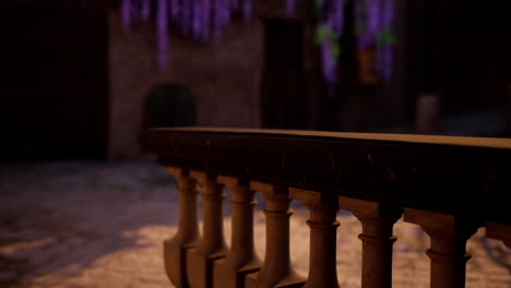 close-up shot of stone railing with balusters in a courtyard at night