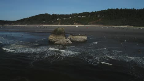 copalis rock offshore of crowded copalis beach in washington, usa