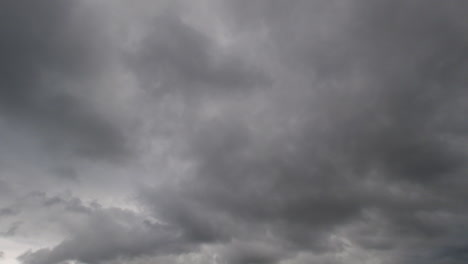 timelapse shot of grey clouds rolling through the sky