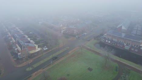 Beautiful-Aerial-of-mist-covered-suburban-neighborhood