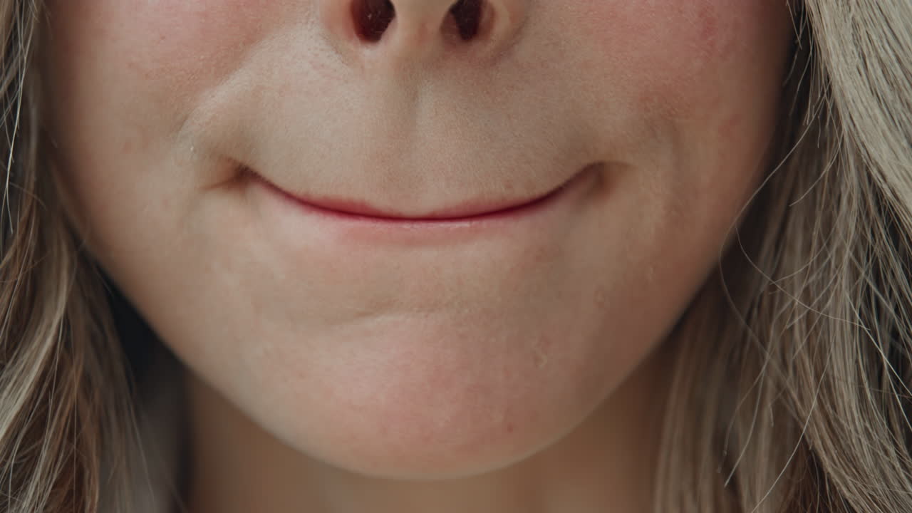 Close-up of woman applying lipstick