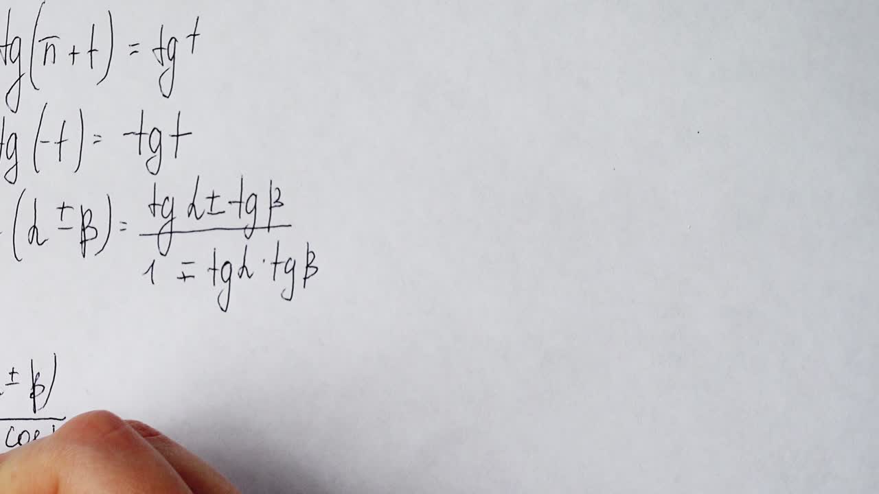 Writing of mathematical formulas on paper. Work of the mathematician