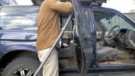 caucasian man cleaning car upholstery