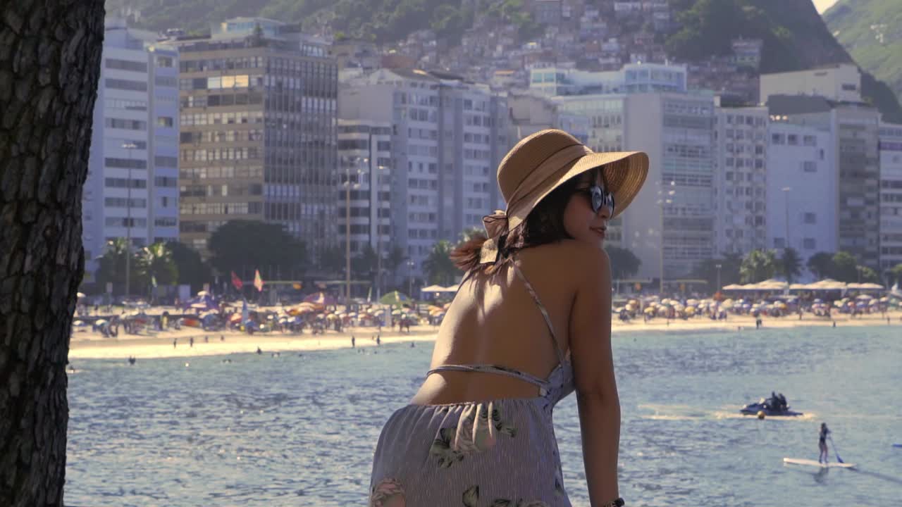 Fashionable Woman Watching Water Sports Off The Beautiful Copacabana Beach  In Rio De Janeiro Free Stock Video Footage Download Clips