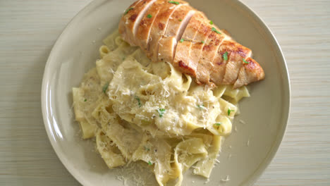 homemade fettucine pasta white creamy sauce with grilled chicken