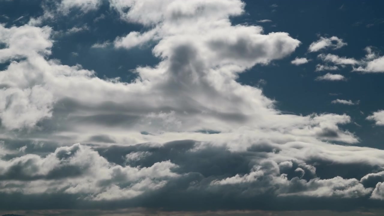 Time Lapse of Dramatic Clouds Moving Across a Deep Blue Sky
