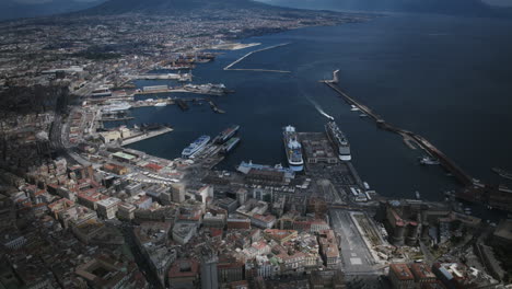 static aerial hyperlapse of the harbor in naples, italy with boats driving around