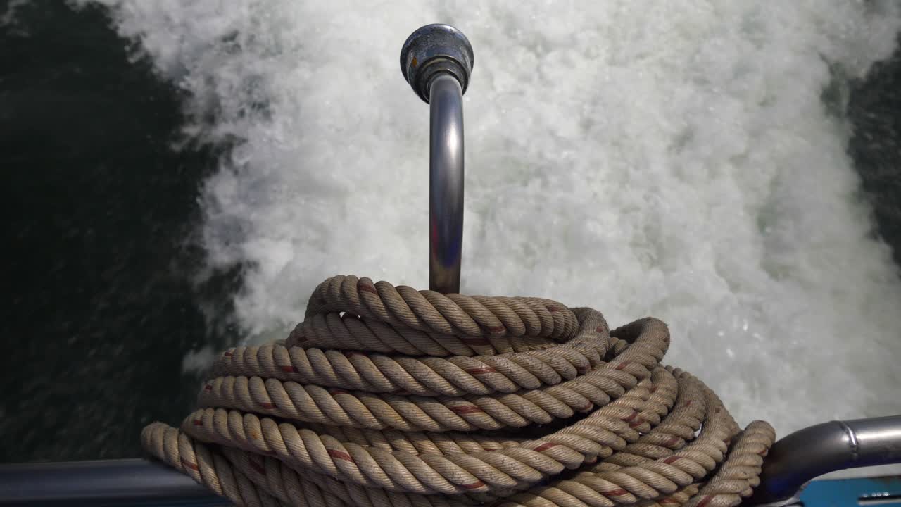 Dock Line With Foamy Traces Behind A Boat. Close-up Shot