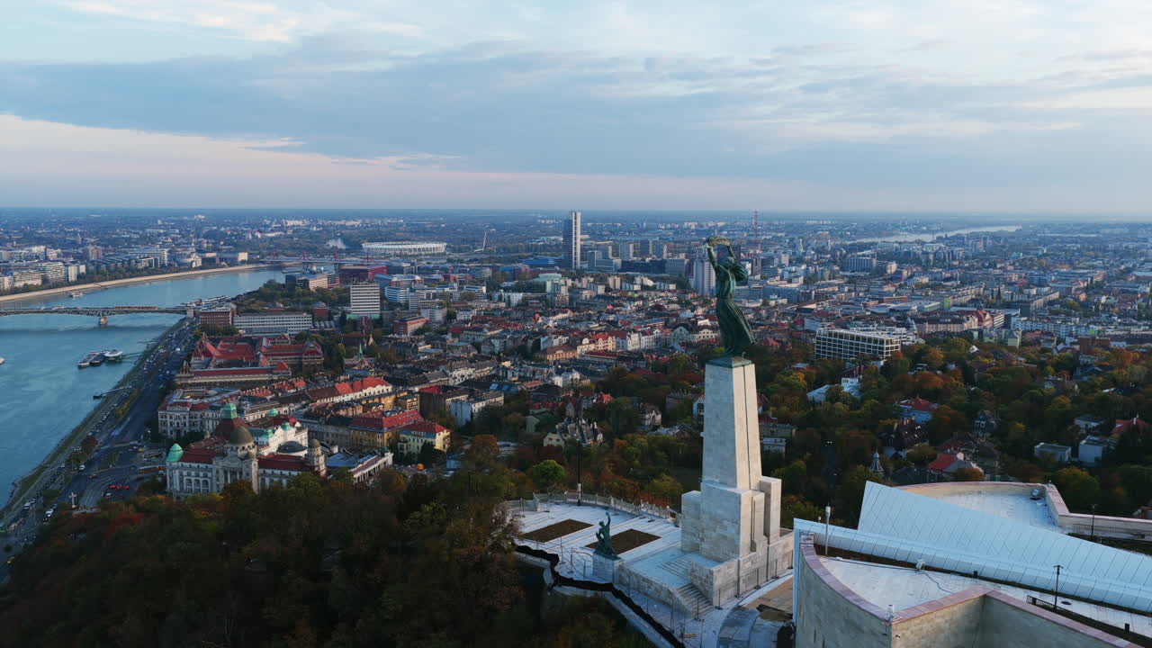 Aerial view of the Liberty Statue at the Citadella, looking over the Danube River and Pest side of Budapest in the late afternoon light
