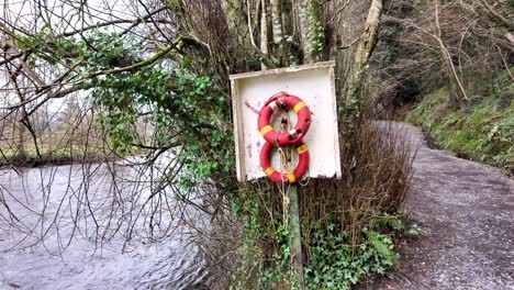 slow motion river nore with lifeboats and riverside trails at inistioge kilkenny ireland