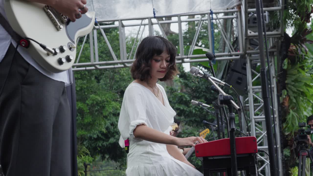 Member of Indonesian band Reality Club performing live at Sunset di Kebun concert in Kebun Raya Bogor