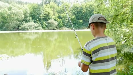 boy fishing in a peaceful pond