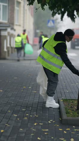 woman cleaning up the street