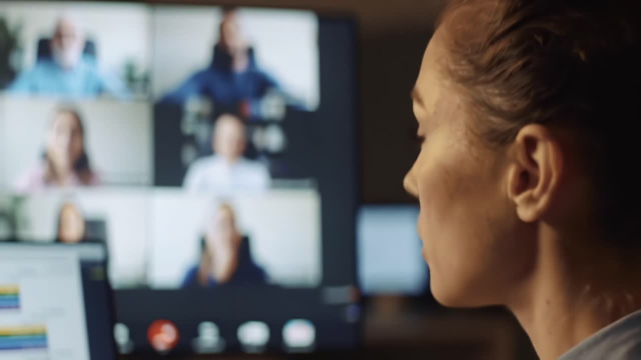 Engaged in a Virtual Meeting, a Person Actively Participates in a Video Conference with Multiple Participants Displayed on the Screen, Reflecting Modern Communication Dynamics
