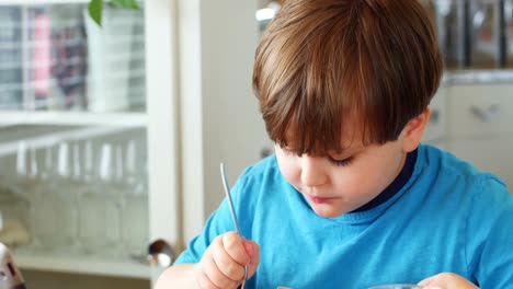 Boy-having-breakfast-on-dinning-table-4k