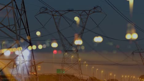 Tráfico-Por-Carretera-En-La-Ciudad-Por-La-Noche-Con-Torres-De-Alta-Tensión-4k